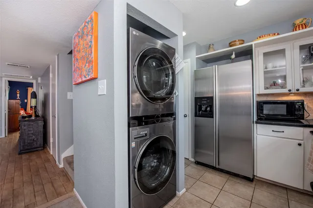 a utility room with closet dryer and washer
