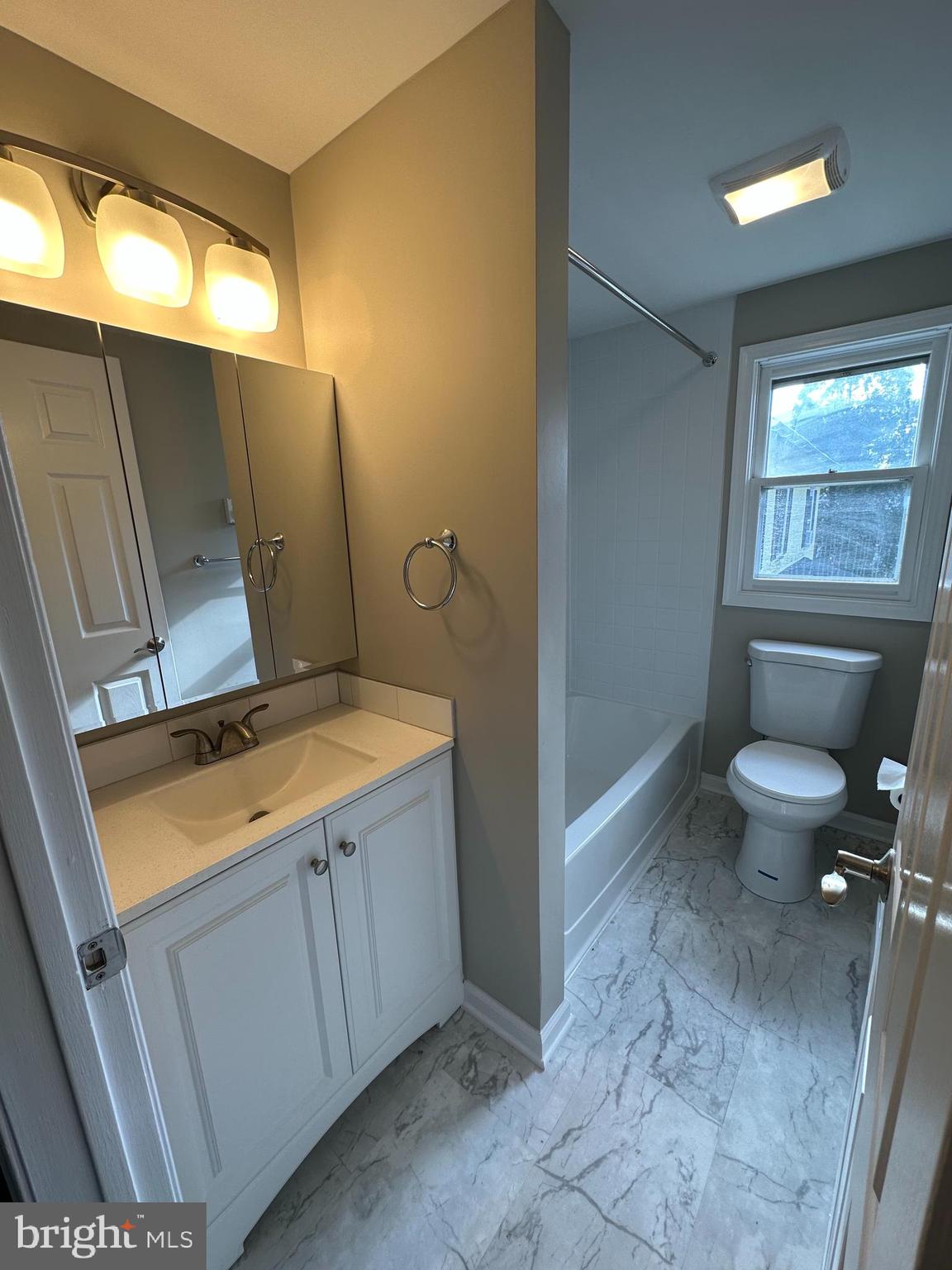 134 A Maple Avenue Dublin, PA 18917 - Photo 16 of 23 a bathroom with a toilet sink and mirror