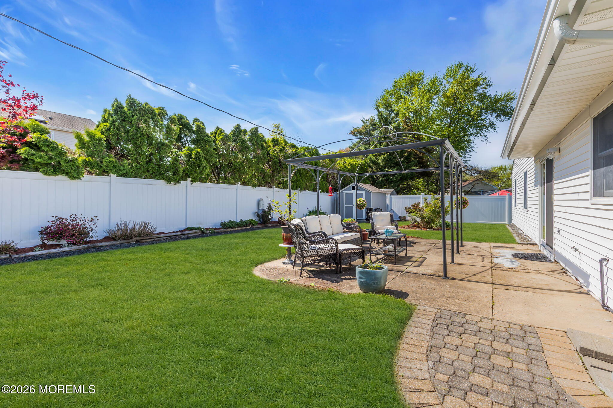 101 Andover Lane Matawan, NJ 07747 - Photo 41 of 51 a view of a backyard with sitting area