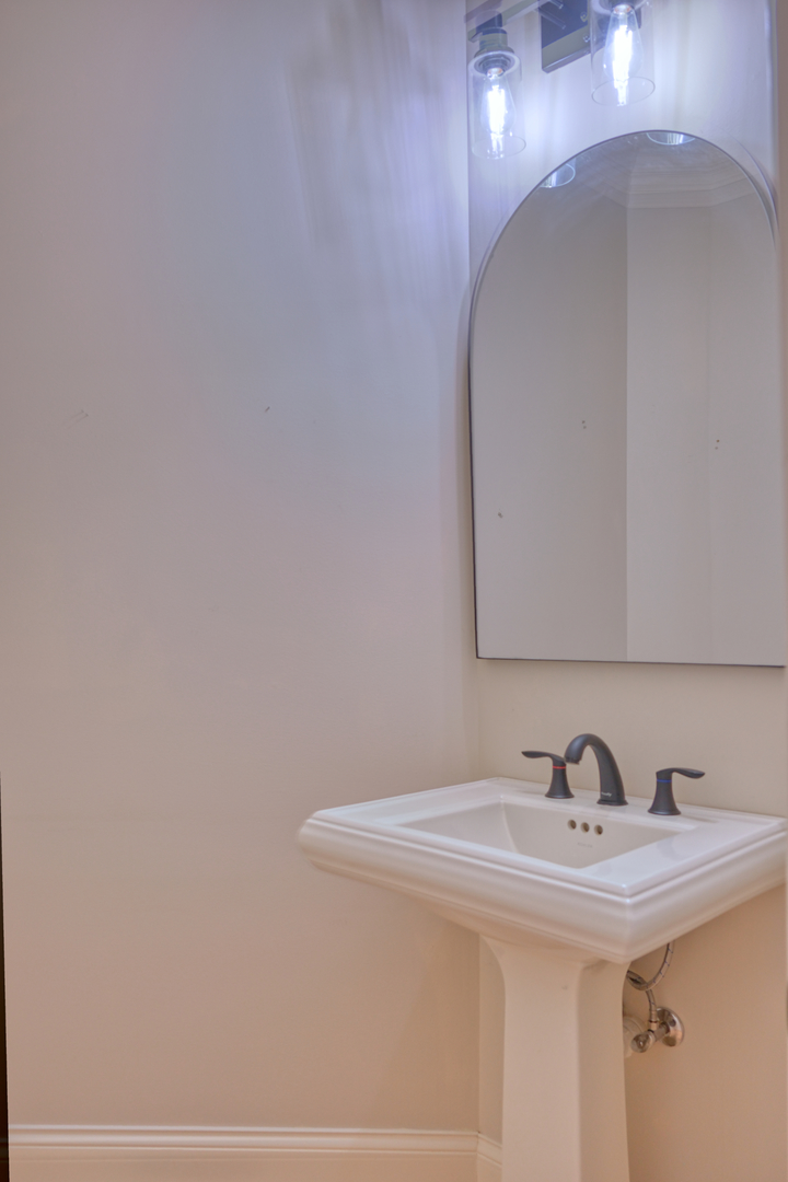 3115 West Striegel Road Carbondale, IL 62901 - Photo 36 of 67 a bathroom with a sink and mirror
