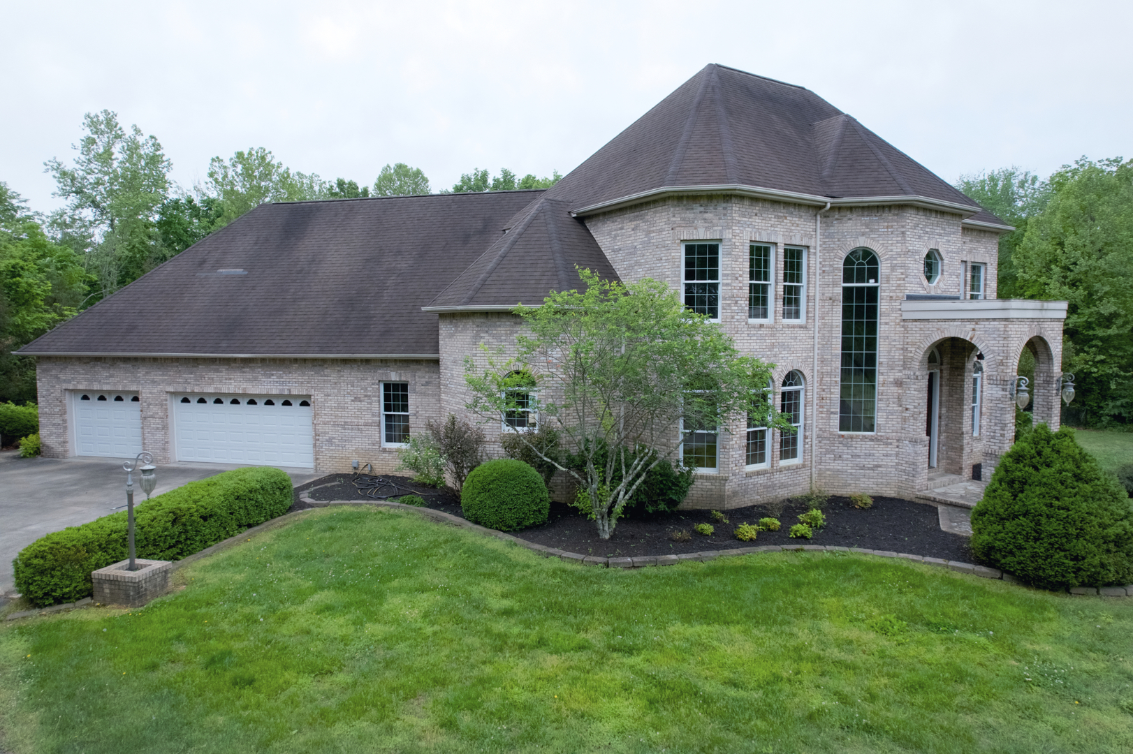 3115 West Striegel Road Carbondale, IL 62901 - Photo 46 of 67 a view of a white house with a yard plants and a table and chairs