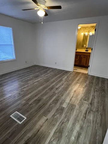 a view of kitchen and wooden floor