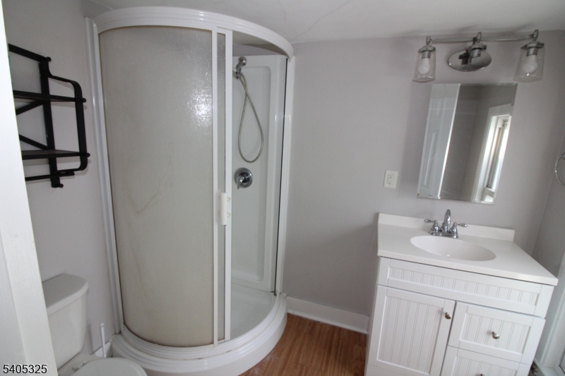 171 Stanton Road, Unit A Flemington, NJ 08822 - Photo 7 of 12 a bathroom with a sink a toilet and shower