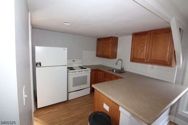 171 Stanton Road, Unit A Flemington, NJ 08822 - Photo 8 of 12 a kitchen with a refrigerator sink and stove