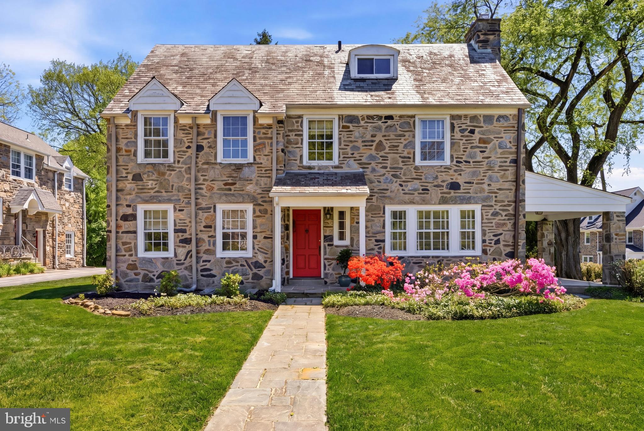 326 Winding Way Merion Station, PA 19066 - Photo 1 of 33 a front view of a house with garden
