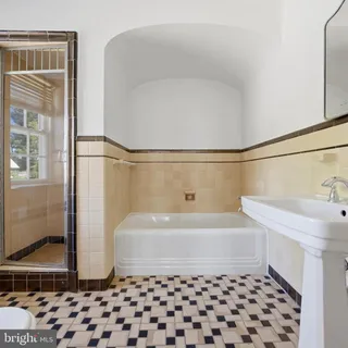 a bathroom with a bathtub and a sink