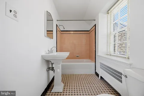 a bathroom with a sink a toilet and a bathtub