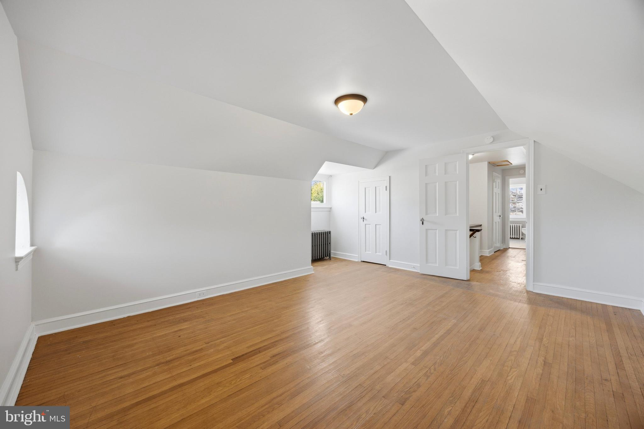 326 Winding Way Merion Station, PA 19066 - Photo 29 of 33 a view of room with wooden floor and windows