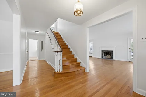 a view of an entryway with wooden floor