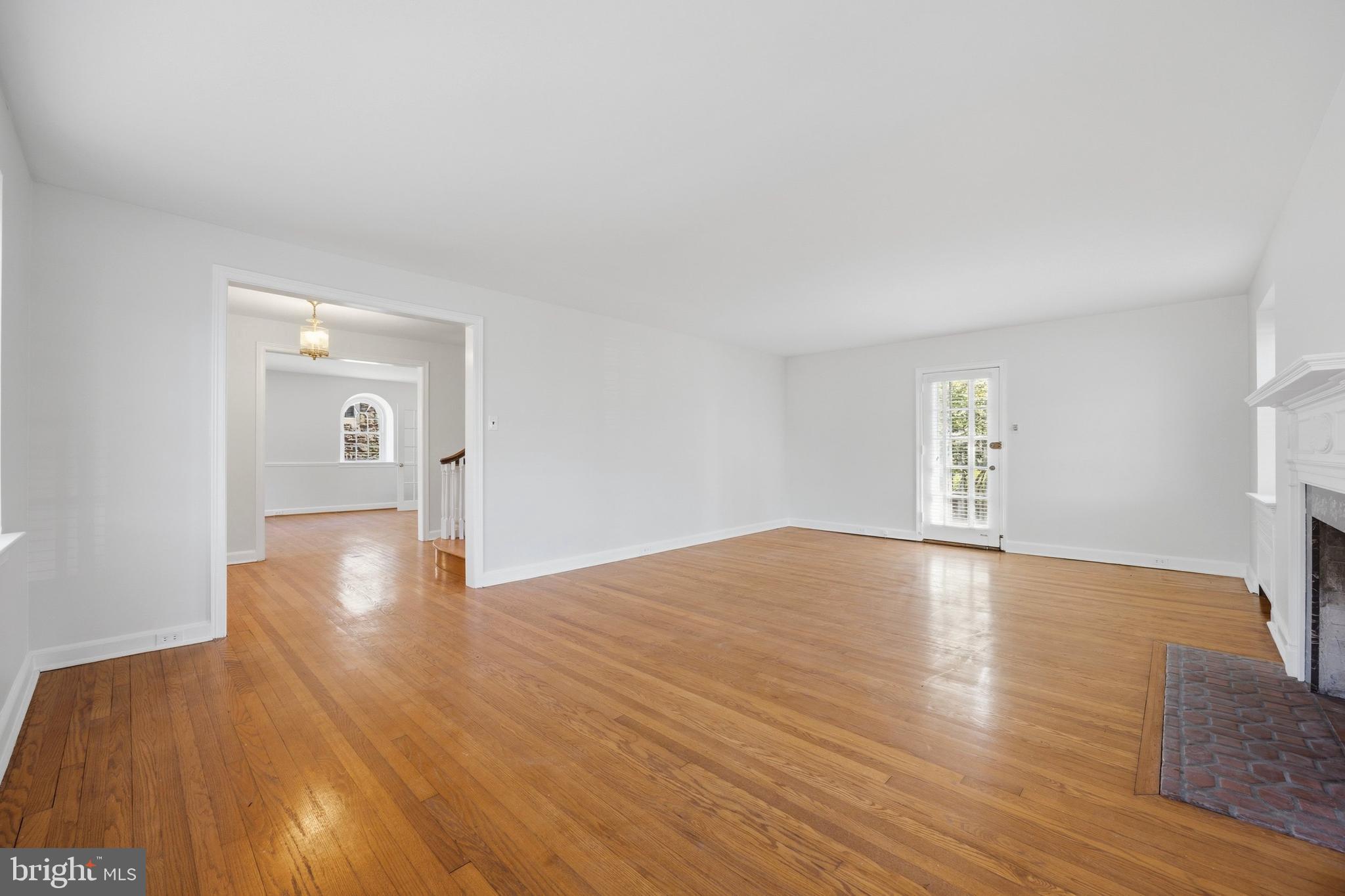 326 Winding Way Merion Station, PA 19066 - Photo 5 of 33 a view of empty room with wooden floor and window