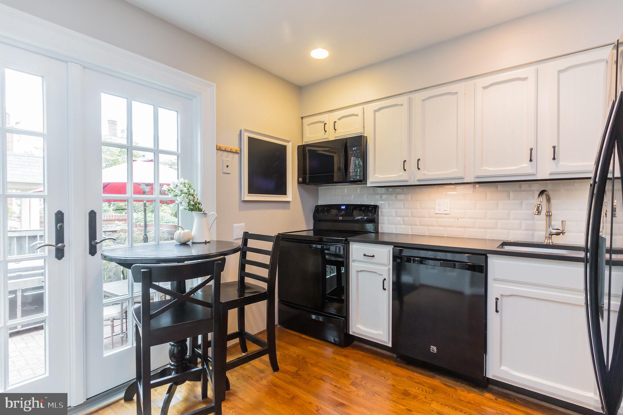 1239 Portner Road Alexandria, VA 22314 - Photo 13 of 73 Leathered granite counters, beveled subway tile