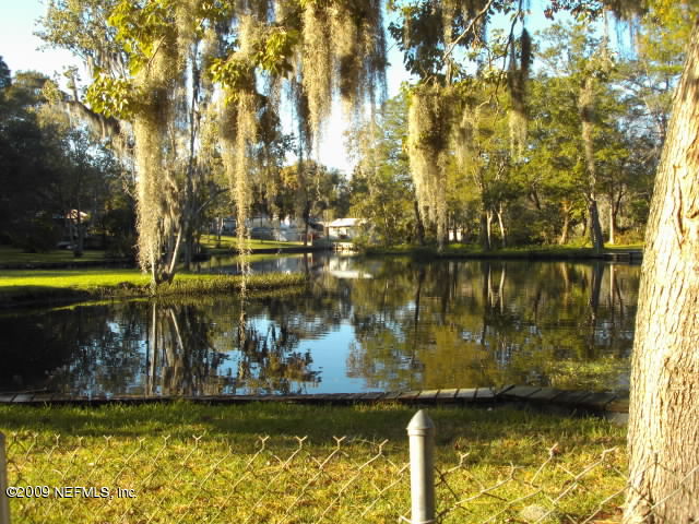 5174 Eulace Road Jacksonville, FL 32210 - Photo 1 of 17 Canal in back yard