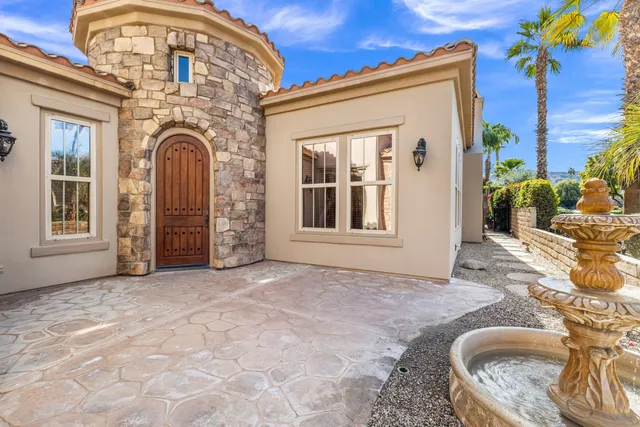 a balcony with table and chairs