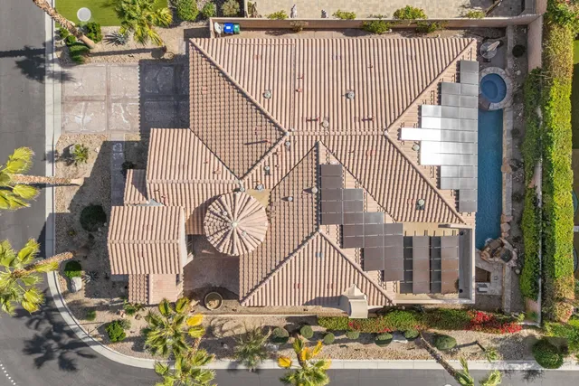 a view of a house with backyard porch and sitting area