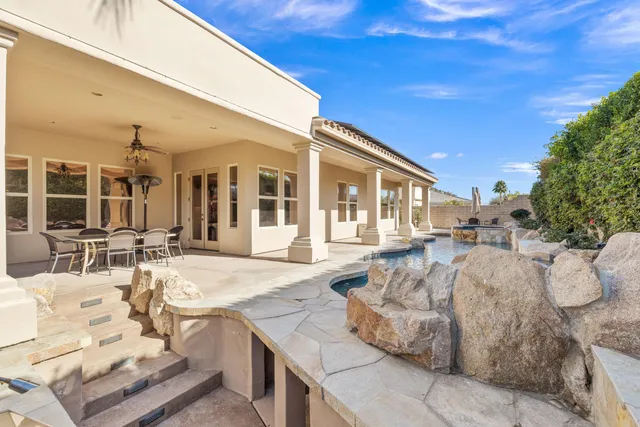 a bedroom with a large bed and a large window