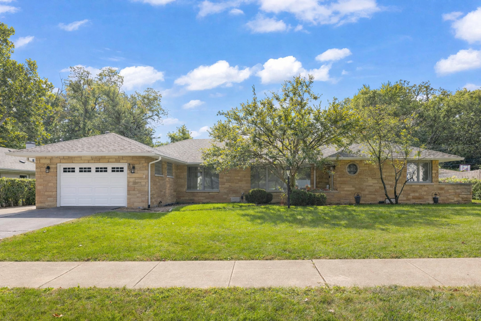 2245 Hawthorne Road Homewood, IL 60430 - Photo 2 of 8 a front view of a house with a yard and garage