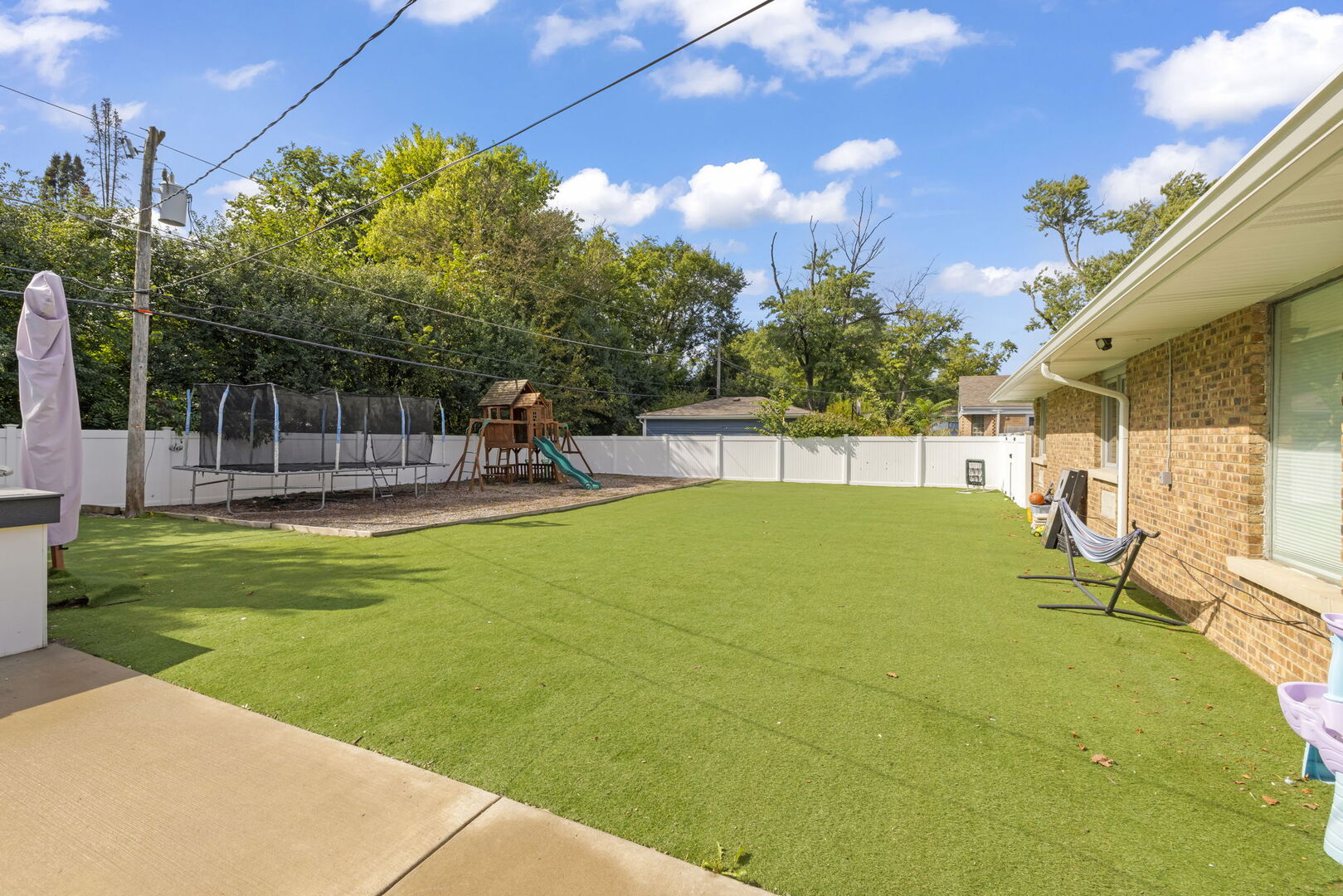 2245 Hawthorne Road Homewood, IL 60430 - Photo 6 of 8 a view of a backyard with a slide