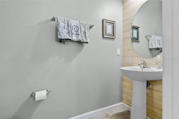 a bathroom with a sink and mirror