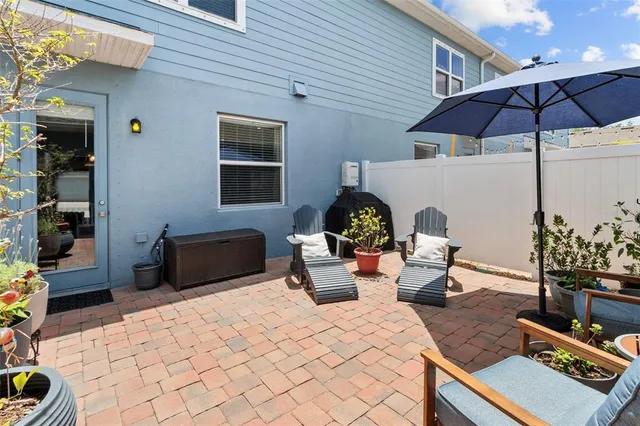a bedroom with furniture and potted plants