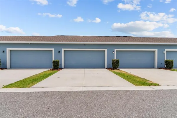 a front view of a house with a garage and a garage