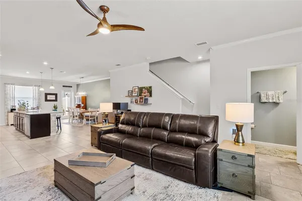a living room with furniture and a lamp