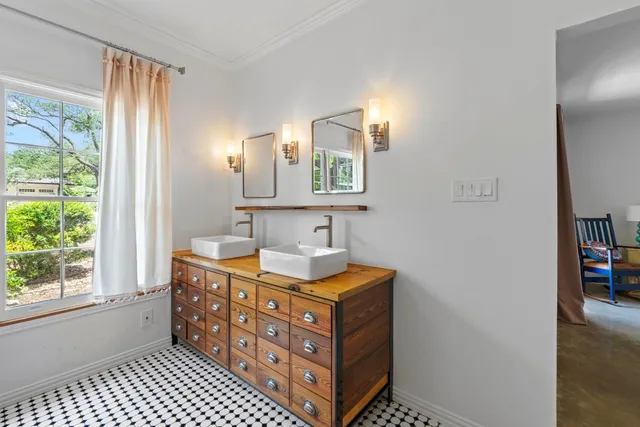 a bedroom with a large bed and a large window