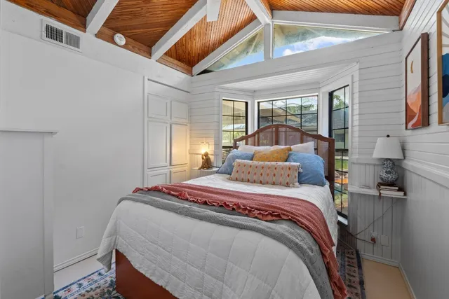 a view of a house with backyard porch and sitting area