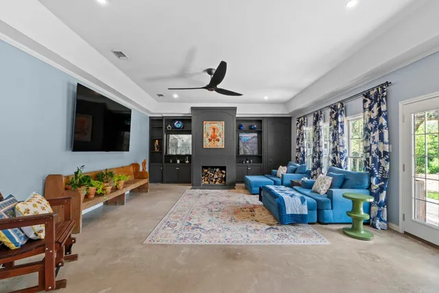 a living room with furniture and a fireplace