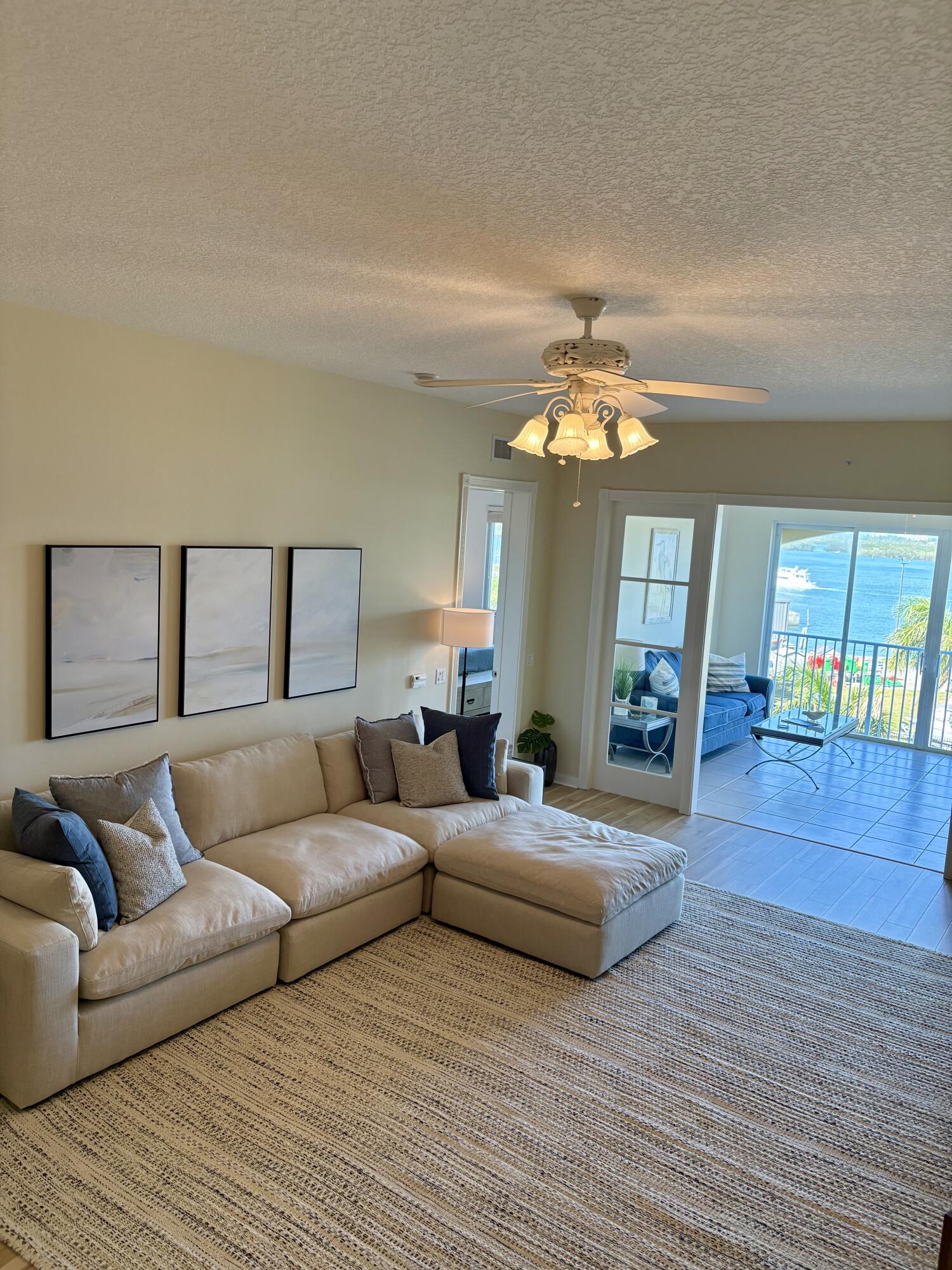 38 Harbour Isle Drive East, Unit PH01 Fort Pierce, FL 34949 - Photo 12 of 30 a living room with furniture and a large window