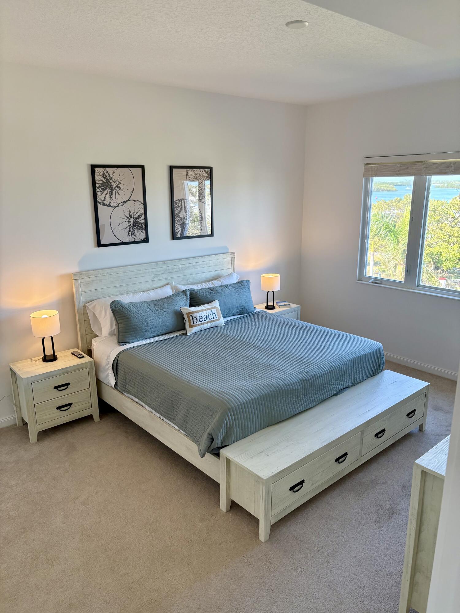 38 Harbour Isle Drive East, Unit PH01 Fort Pierce, FL 34949 - Photo 16 of 30 a spacious bedroom with a bed and window