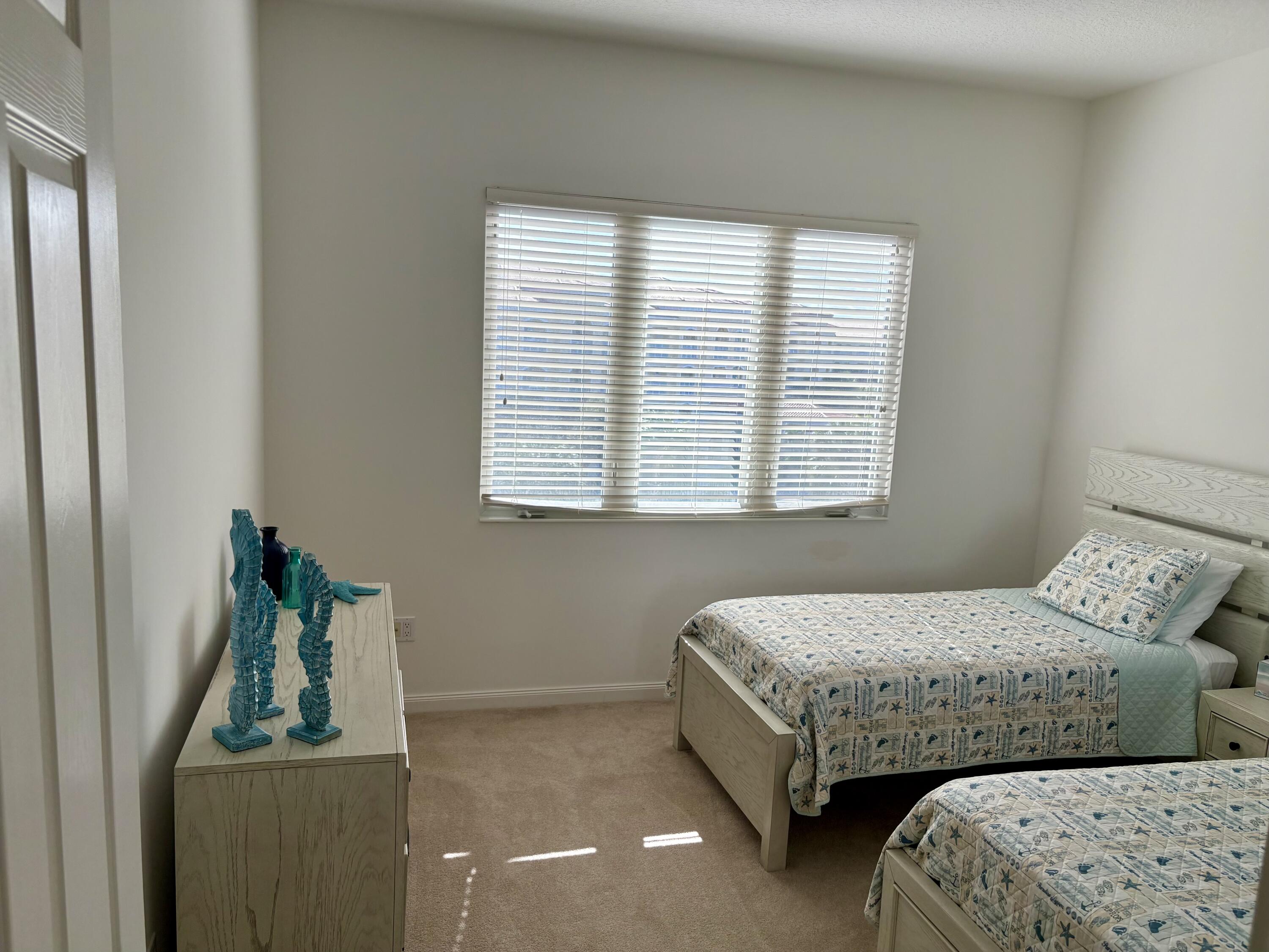 38 Harbour Isle Drive East, Unit PH01 Fort Pierce, FL 34949 - Photo 26 of 30 a bedroom with bed and window