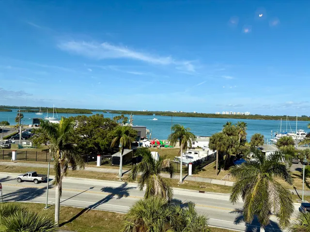 a view of a terrace with lawn chairs
