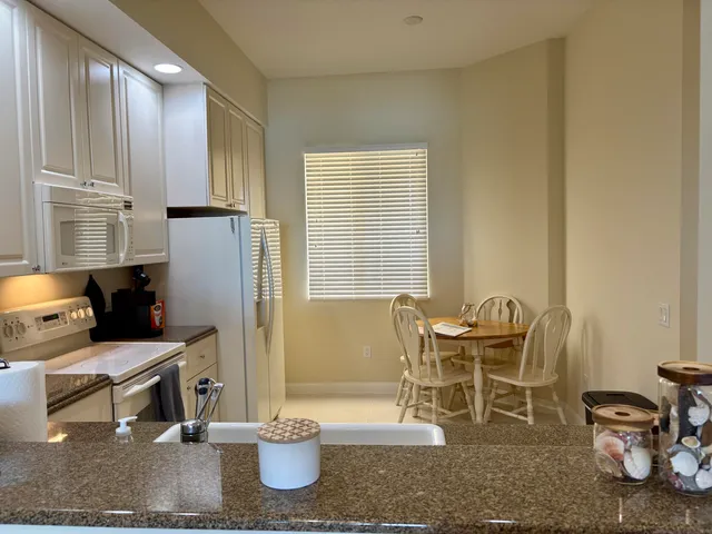 a living room with furniture a rug and a window