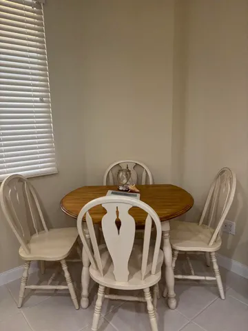 a view of a dining room with furniture and window
