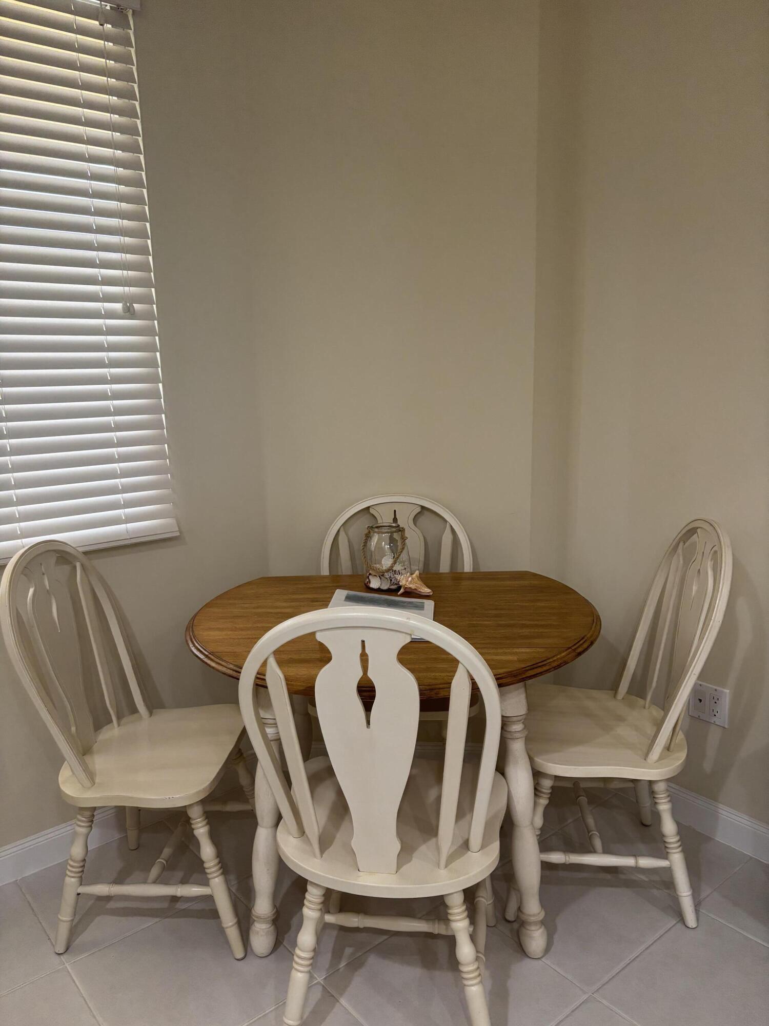 38 Harbour Isle Drive East, Unit PH01 Fort Pierce, FL 34949 - Photo 6 of 30 a view of a dining room with furniture and window