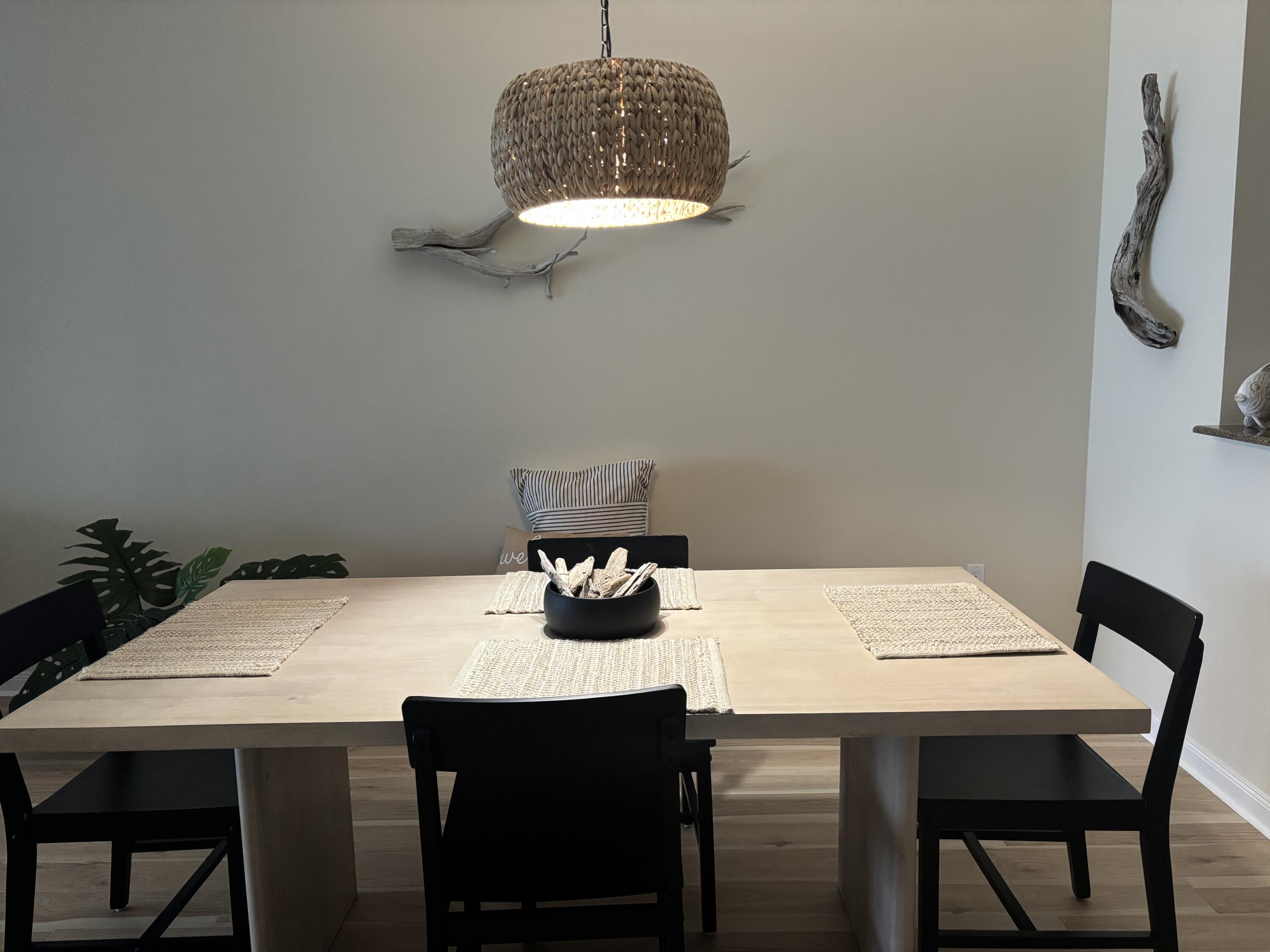 38 Harbour Isle Drive East, Unit PH01 Fort Pierce, FL 34949 - Photo 9 of 30 a table with a vase and chandelier