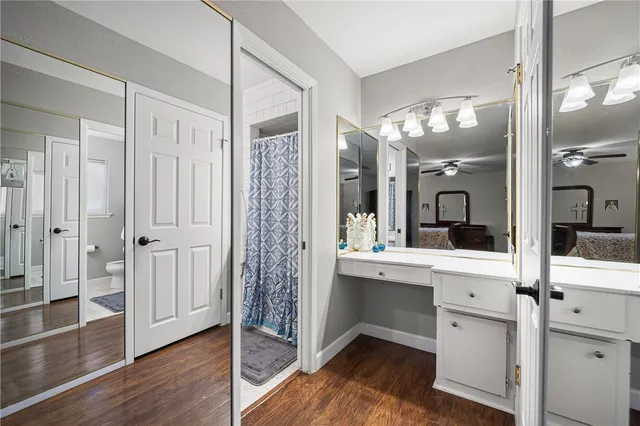 a view of entryway with dining room and wooden floor