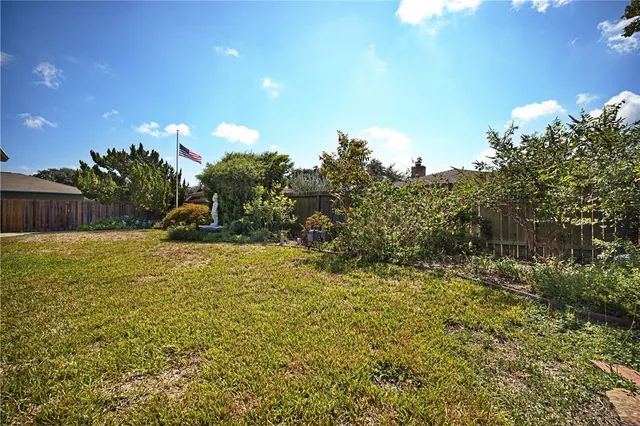 a view of a swimming pool with an outdoor space and seating area