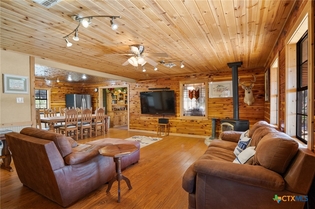 1465 County Road 401 Edna, TX 77957 - Photo 12 of 46 a living room with furniture and a flat screen tv