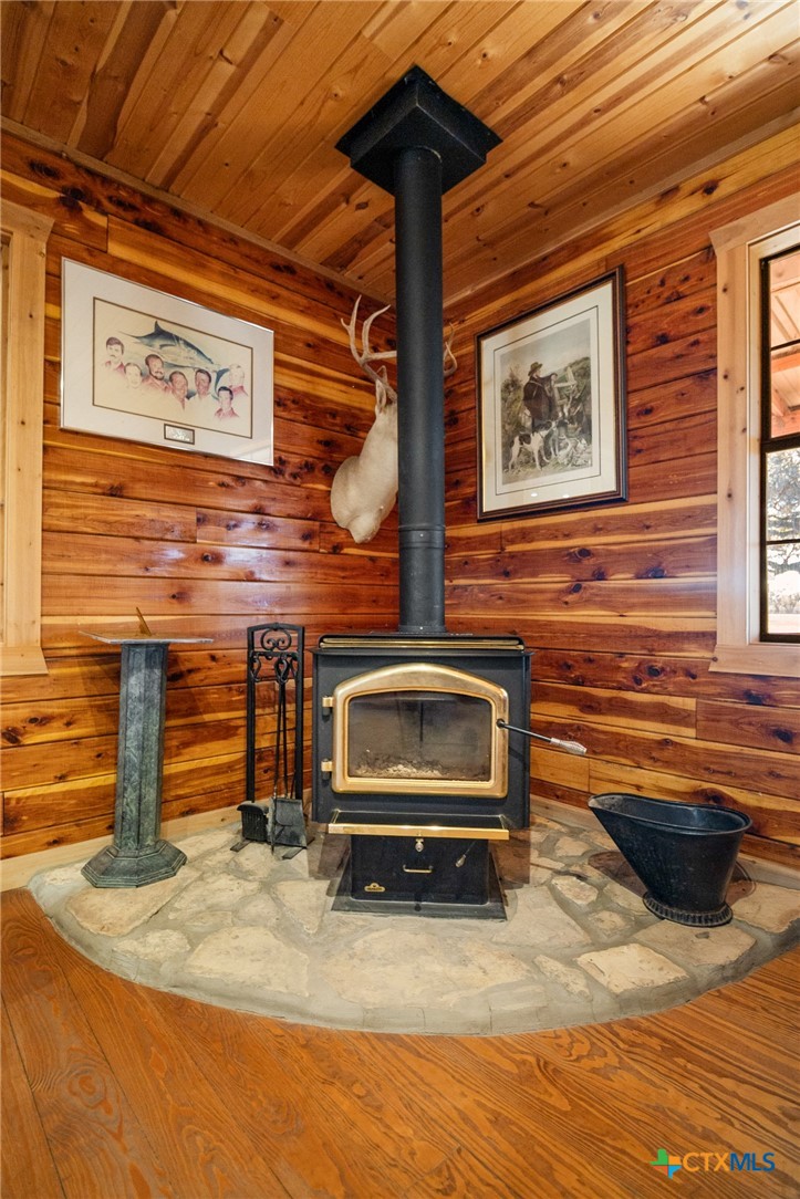 1465 County Road 401 Edna, TX 77957 - Photo 13 of 46 a living room with stainless steel appliances kitchen island a stove and a refrigerator