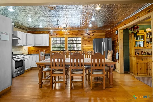 a kitchen with granite countertop a stove and a sink