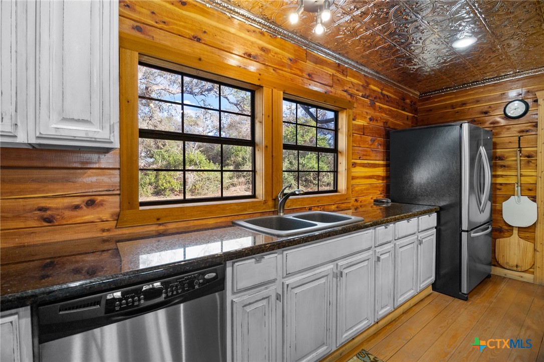 1465 County Road 401 Edna, TX 77957 - Photo 18 of 46 a kitchen with a sink and a stove