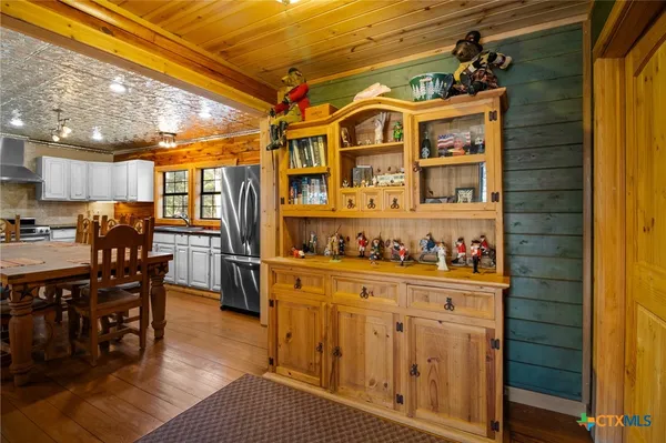 a living room with furniture gym equipment and a flat screen tv