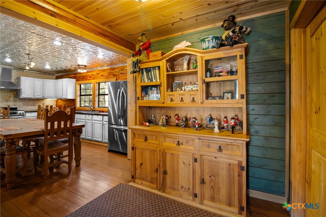 1465 County Road 401 Edna, TX 77957 - Photo 19 of 46 a open kitchen with stainless steel appliances granite countertop a stove and cabinets