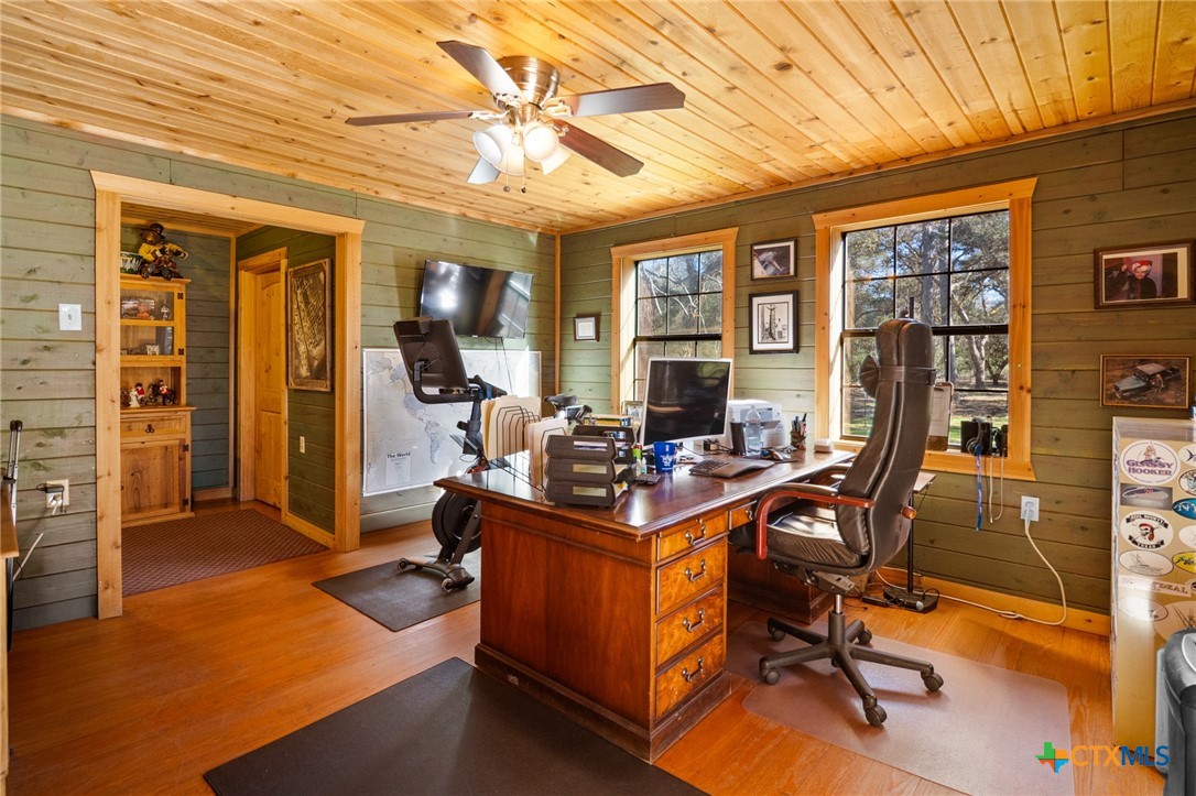 1465 County Road 401 Edna, TX 77957 - Photo 21 of 46 a view of a livingroom with workspace and a window