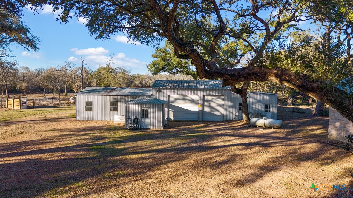 1465 County Road 401 Edna, TX 77957 - Photo 33 of 46 a view of a house with a yard