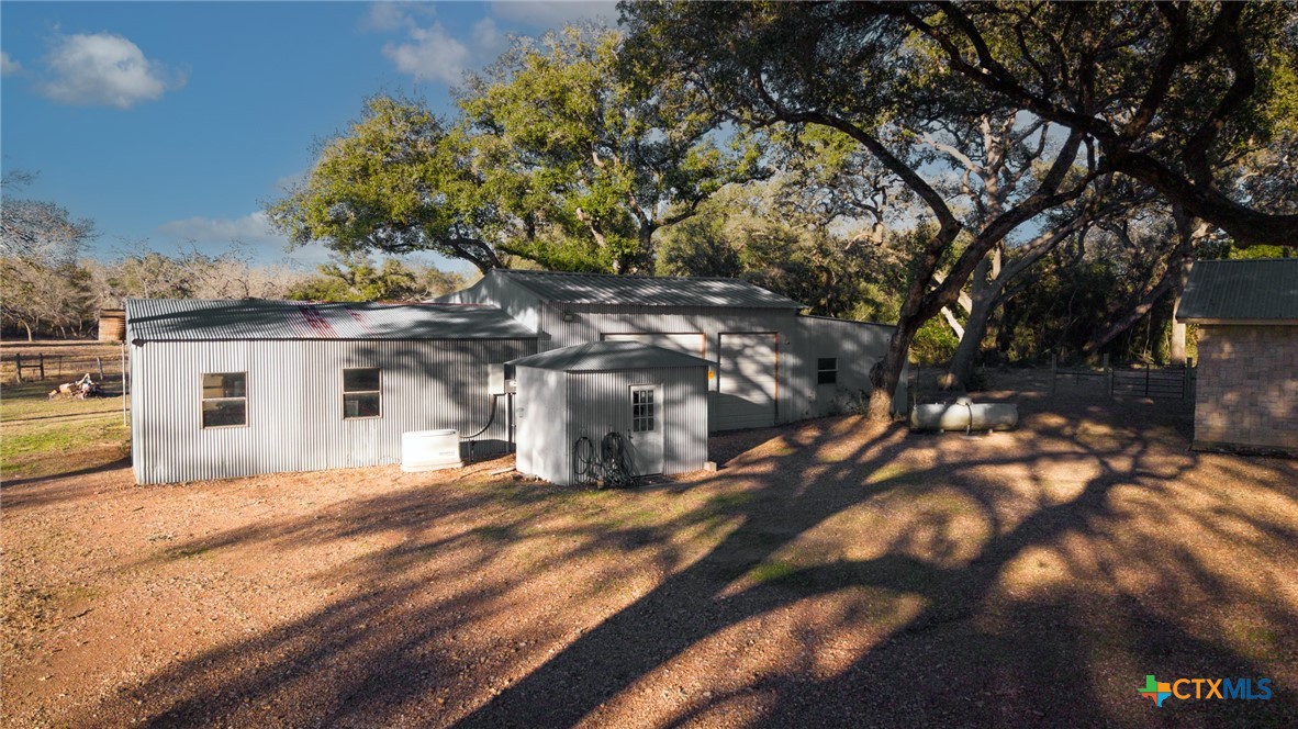 1465 County Road 401 Edna, TX 77957 - Photo 34 of 46 a view of a house with a yard