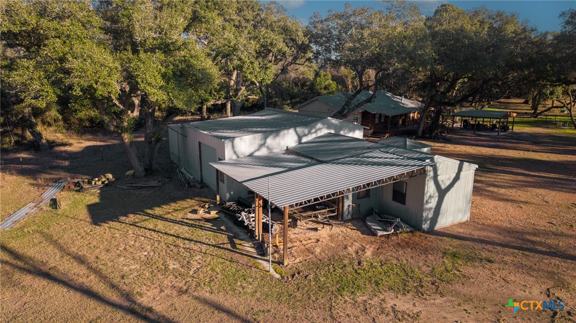 1465 County Road 401 Edna, TX 77957 - Photo 36 of 46 a view of a house with backyard and sitting area