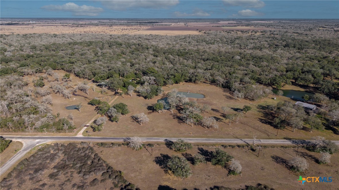 1465 County Road 401 Edna, TX 77957 - Photo 42 of 46 a view of a dry yard with wooden fence