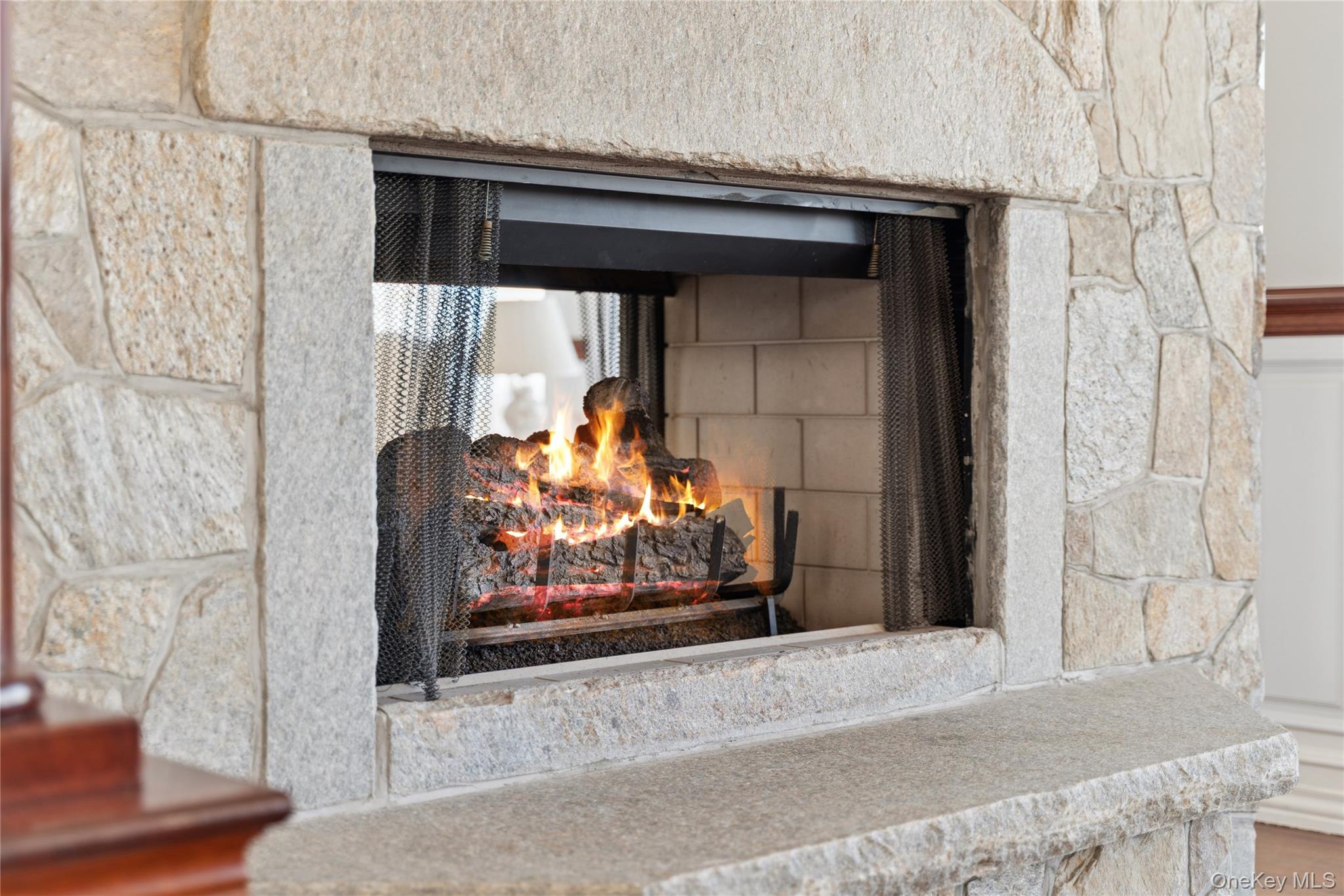 1680 Lands End Road Orient, NY 11957 - Photo 15 of 50 Two Sided Gas Fireplace for Both the Living Room and Dining Room